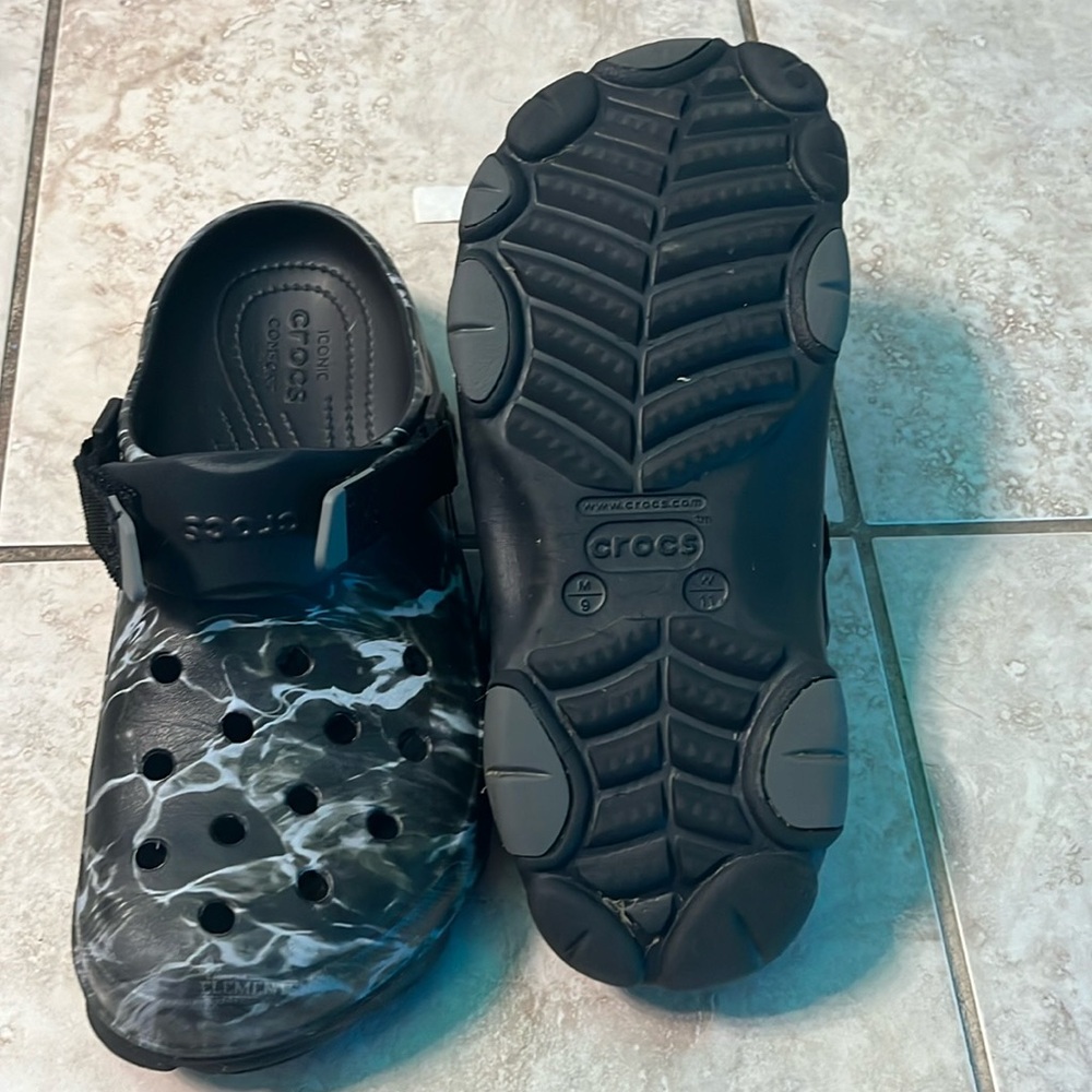 Black crocks with design